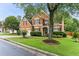 Beautiful two-story brick home showcasing a well-kept lawn and mature trees at , Atlanta, GA 30360