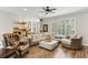 Open living area with wood floors, large windows, and a glimpse of the connected kitchen at , Atlanta, GA 30360