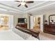 This primary bedroom has a tray ceiling and ensuite bathroom with a walk-in shower and separate soaking tub at , Atlanta, GA 30360