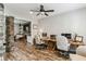 Home office space adjacent to stone columns and featuring a desk, chairs and monitors at , Atlanta, GA 30360