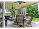 Relaxing covered patio featuring stylish outdoor furniture and ceiling fans at , Atlanta, GA 30360