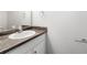 Bathroom vanity features a dark granite countertop, white cabinets, and a modern oval sink at 1086 Erie Cir, Stone Mountain, GA 30087