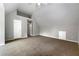 Vaulted ceilings, neutral paint, and a double door closet highlight this carpeted bedroom at 1086 Erie Cir, Stone Mountain, GA 30087