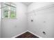 Walk-in closet includes modern wood flooring, a window view, and white wire shelving at 1086 Erie Cir, Stone Mountain, GA 30087