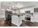 Modern kitchen boasting white cabinets, stainless steel appliances, and a center island at 1086 Erie Cir, Stone Mountain, GA 30087