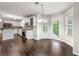 Bright kitchen with white cabinets, stainless appliances, and a cozy breakfast nook with outdoor access at 1086 Erie Cir, Stone Mountain, GA 30087