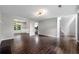 Open-concept living room featuring hardwood floors, neutral walls, and ample natural light at 1086 Erie Cir, Stone Mountain, GA 30087