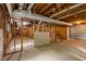 Spacious unfinished basement featuring concrete flooring, exposed ductwork, and exposed wooden framework at 2892 Guinevere Ne Dr, Atlanta, GA 30345