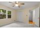 This bedroom features a ceiling fan, closet, and neutral colored walls at 2892 Guinevere Ne Dr, Atlanta, GA 30345