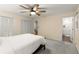 This main bedroom has a closet, a ceiling fan, and carpeted floors at 2892 Guinevere Ne Dr, Atlanta, GA 30345