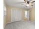 Bedroom featuring a ceiling fan, large closet, window, and carpeted floors at 2892 Guinevere Ne Dr, Atlanta, GA 30345