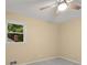 Bedroom featuring a ceiling fan, window, and carpeted floors at 2892 Guinevere Ne Dr, Atlanta, GA 30345