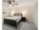 This main bedroom has a ceiling fan, carpet, a bed, and two windows at 2892 Guinevere Ne Dr, Atlanta, GA 30345
