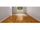 Bright room with hardwood floors and a window overlooking a green yard at 2892 Guinevere Ne Dr, Atlanta, GA 30345