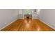 Open-concept dining area with hardwood floors, neutral walls, and view of outdoor space at 2892 Guinevere Ne Dr, Atlanta, GA 30345