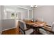 Charming dining area features a beautiful wood table and sun-drenched windows at 2892 Guinevere Ne Dr, Atlanta, GA 30345