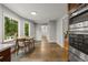 Bright kitchen featuring a dining area, stainless steel appliances, and access to the deck with wooded views at 2892 Guinevere Ne Dr, Atlanta, GA 30345