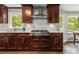 Modern kitchen featuring a stainless steel range, custom cabinetry, and natural light from large windows at 2892 Guinevere Ne Dr, Atlanta, GA 30345