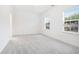Bright bedroom with two large windows, neutral walls, and plush carpet at 3514 Ambassador Aly, Scottdale, GA 30079