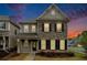 Charming two-story home with stone accents, complemented by professional landscaping and a welcoming entryway at 3514 Ambassador Aly, Scottdale, GA 30079