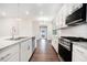 Bright kitchen with stainless steel appliances, granite countertops, and modern fixtures at 3514 Ambassador Aly, Scottdale, GA 30079
