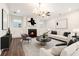 Modern living room with fireplace, recessed lighting and stylish decor at 3514 Ambassador Aly, Scottdale, GA 30079