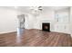 A spacious living room offering hardwood floors, fireplace, and bright light to enjoy time with loved ones at 3514 Ambassador Aly, Scottdale, GA 30079