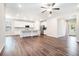 Open floor plan connecting a modern kitchen with an island to a spacious living area, perfect for entertaining at 3514 Ambassador Aly, Scottdale, GA 30079