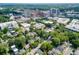 Scenic aerial view of residential area with mature trees and city skyline at 560 Morgan Ne St, Atlanta, GA 30308