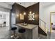 A modern bar area with slate floors, pendant lights, and counter seating at 560 Morgan Ne St, Atlanta, GA 30308