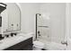 Modern bathroom with a marble countertop, sleek fixtures, and shower at 560 Morgan Ne St, Atlanta, GA 30308
