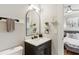 Bright bathroom with marble countertops, modern fixtures, and an arched mirror at 560 Morgan Ne St, Atlanta, GA 30308