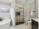 Elegant bathroom with a standalone tub, walk-in shower, and marble accents at 560 Morgan Ne St, Atlanta, GA 30308