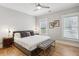 A well-lit bedroom with two windows, a ceiling fan, and hardwood floors at 560 Morgan Ne St, Atlanta, GA 30308