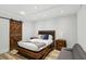 Bedroom showcasing a modern barn door and neutral design with dark wood accents at 560 Morgan Ne St, Atlanta, GA 30308