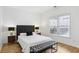 Comfortable bedroom with a plush bed, modern lamps, and hardwood floors at 560 Morgan Ne St, Atlanta, GA 30308