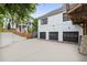 Exterior shot showing three car garage, stairs to back porch and a manicured backyard at 560 Morgan Ne St, Atlanta, GA 30308