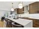 Spacious kitchen featuring a large island with seating, modern appliances, and hardwood floors at 560 Morgan Ne St, Atlanta, GA 30308