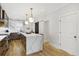 Bright kitchen featuring modern appliances, marble countertops, and a stylish island with pendant lighting at 560 Morgan Ne St, Atlanta, GA 30308