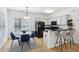 Bright kitchen featuring stainless steel appliances, bar seating, and a nearby dining area at 560 Morgan Ne St, Atlanta, GA 30308