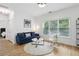 Inviting living room with a cozy couch, decorative pillows, and stylish decor at 560 Morgan Ne St, Atlanta, GA 30308