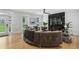 Open-concept living room featuring hardwood floors, a sleek fireplace, and modern furnishings is ideal for relaxation at 560 Morgan Ne St, Atlanta, GA 30308