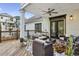 Spacious outdoor deck featuring comfortable seating, ceiling fan, and access to the backyard at 560 Morgan Ne St, Atlanta, GA 30308