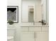 Bathroom showcasing a toilet, vanity with cabinet storage, decor, and framed artwork at 811 Atkins Ln, Woodstock, GA 30188