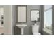 Powder room with a pedestal sink and natural light at 811 Atkins Ln, Woodstock, GA 30188