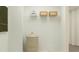 Laundry room with storage shelving and a stylish hamper at 811 Atkins Ln, Woodstock, GA 30188