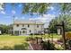 Expansive backyard featuring a well-manicured lawn and a charming two-story home with a patio at 105 Pine Valley Ct, Hiram, GA 30141