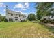 Expansive backyard featuring a well-maintained lawn and mature trees providing ample shade at 105 Pine Valley Ct, Hiram, GA 30141