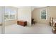 Bright and airy bedroom featuring neutral walls, plush carpeting, and two large windows offering plenty of natural light at 105 Pine Valley Ct, Hiram, GA 30141