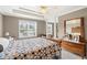 Bright bedroom features a tray ceiling, and a large window letting in natural light at 105 Pine Valley Ct, Hiram, GA 30141